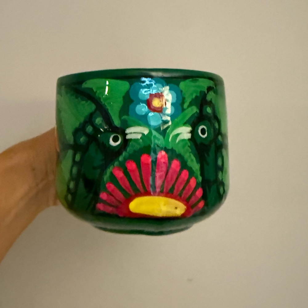 Beautiful bright colorful green birds with flowers pottery mug cup. Mexico